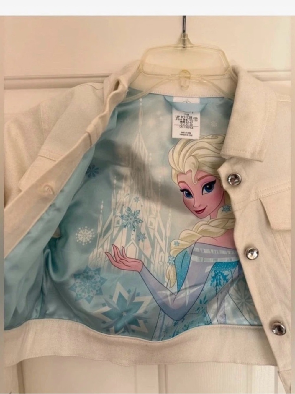 Disney’s Frozen cropped White Jean Jacket with Blue Snowflake Accents